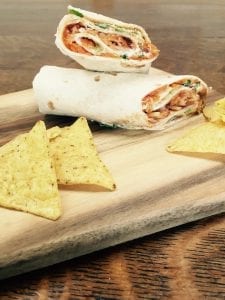 Manchego cheese with grated carrot, cabbage, sour cream, coriander and Shaws Devilish Tomato & Chili Relish wrap